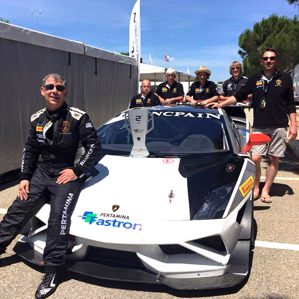 topcats racing team celebrating 2nd racing position finish with white and black lamborghini gallardo
