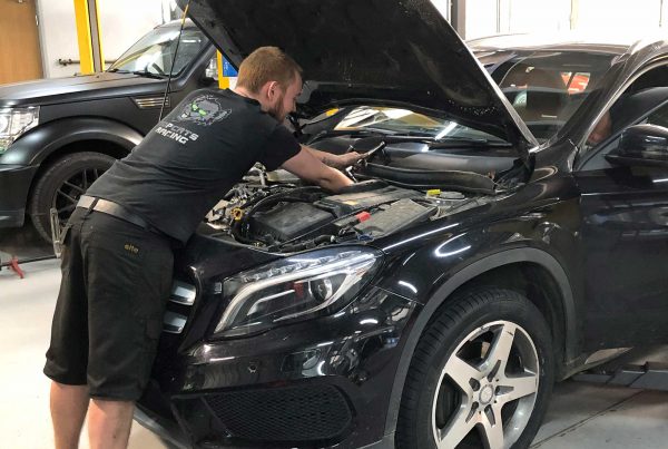 topcats team member working on mercedes road vehicle