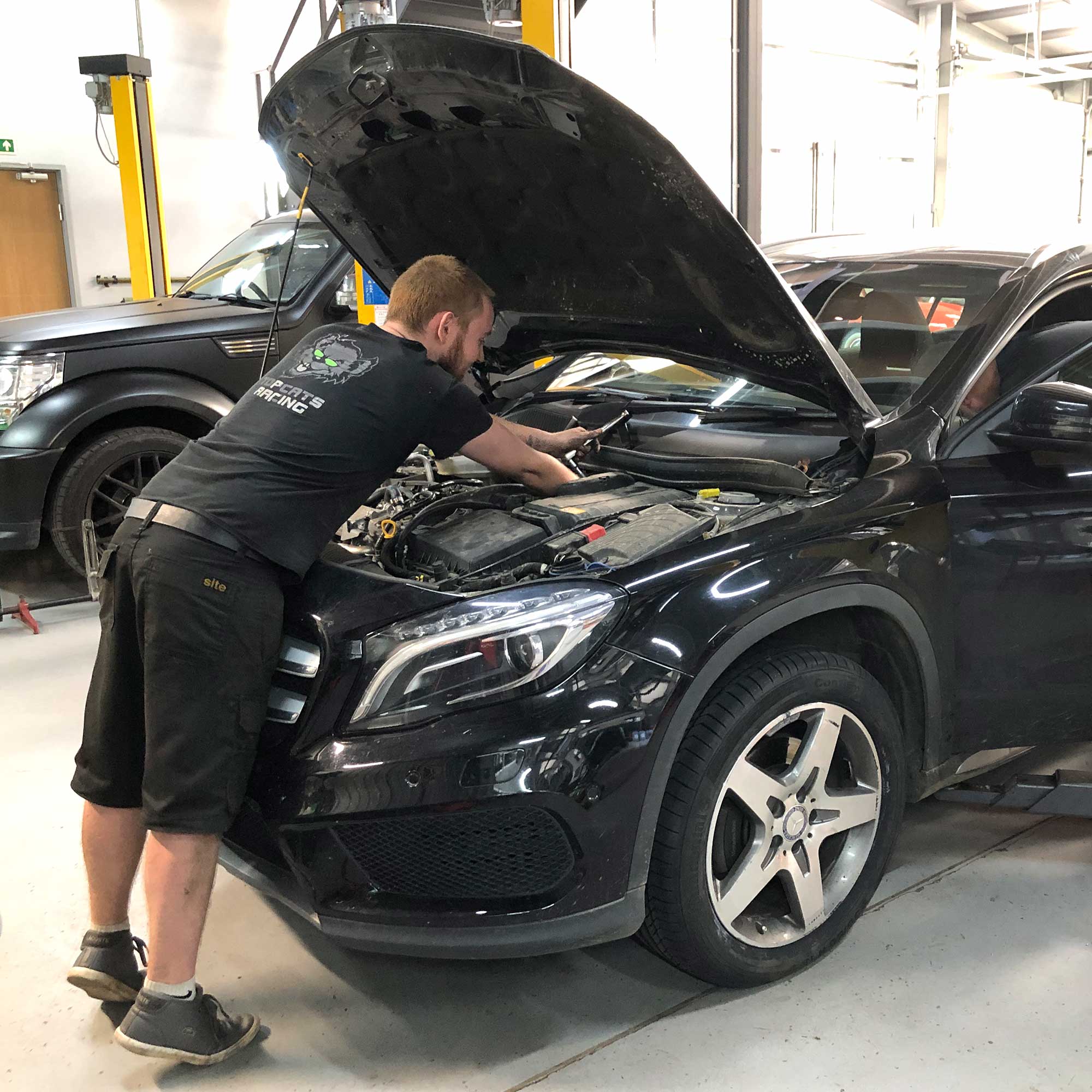 topcats team member working on mercedes road vehicle