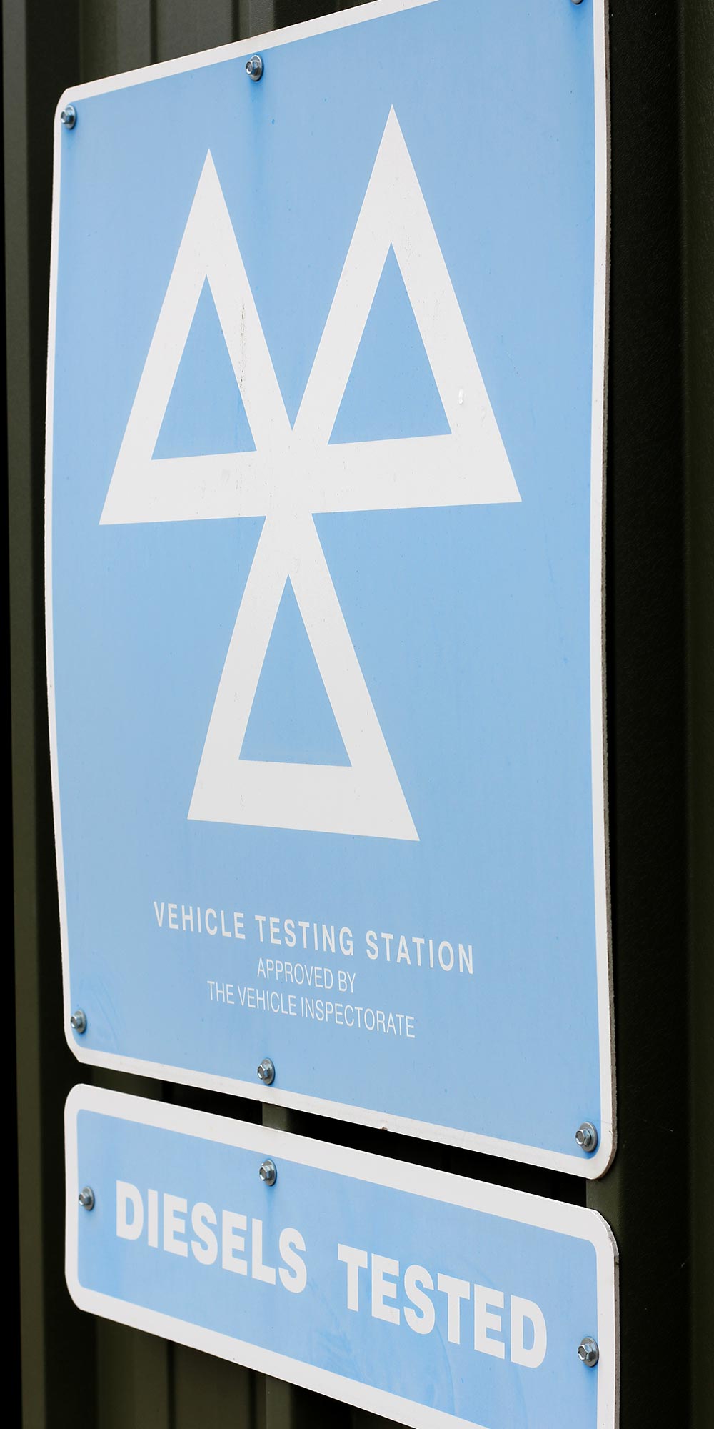 mot vehicle testing station sign at topcats racing workshop