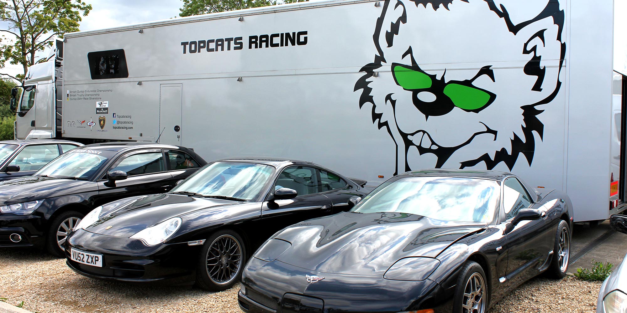 topcats racing rig stationed outside workshop