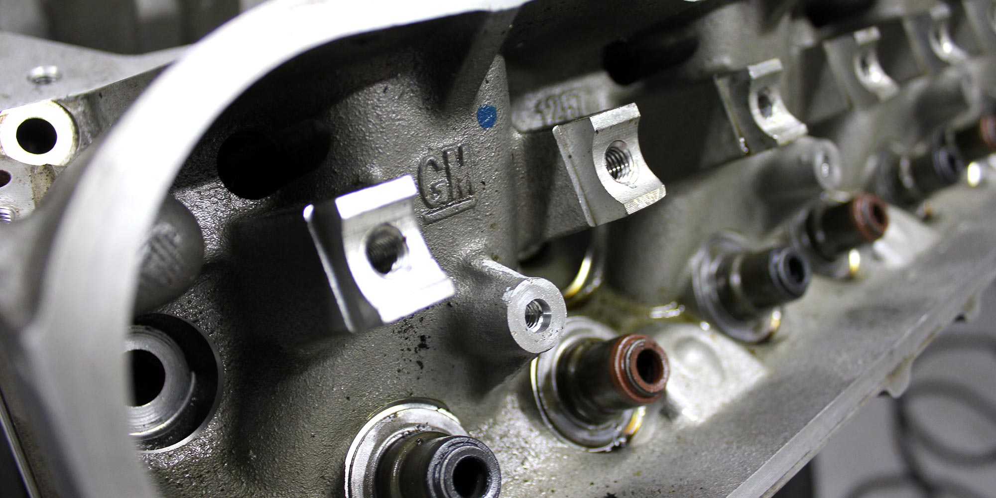 close up of cylinder head of v8 engine at topcats racing workshop