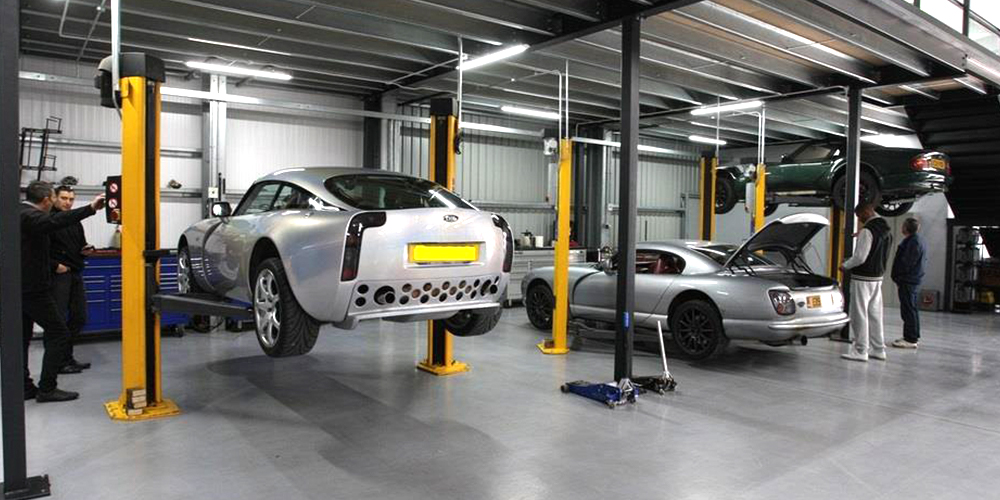 photo of silver tvr 350 on topcats racing ramp and silver tvr cerbera with boot open