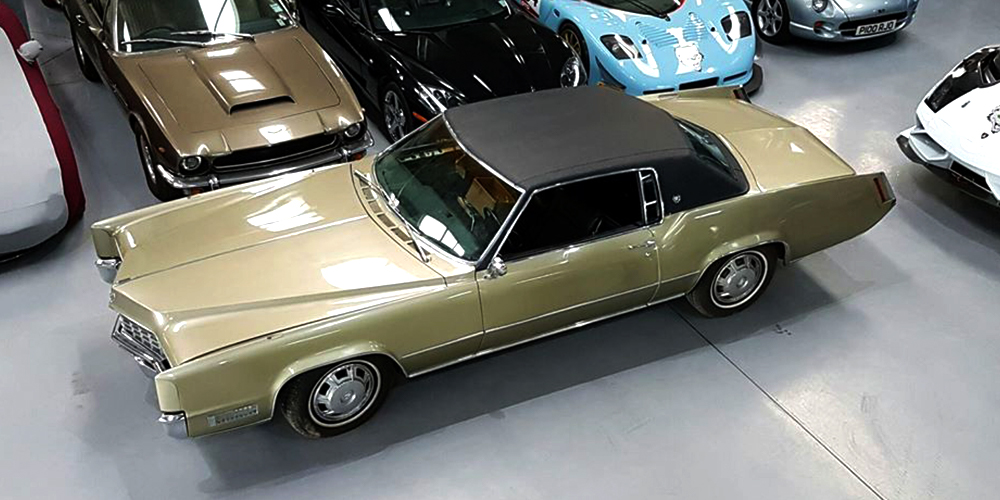 champagne coloured cadillac deville in topcats racing workshop