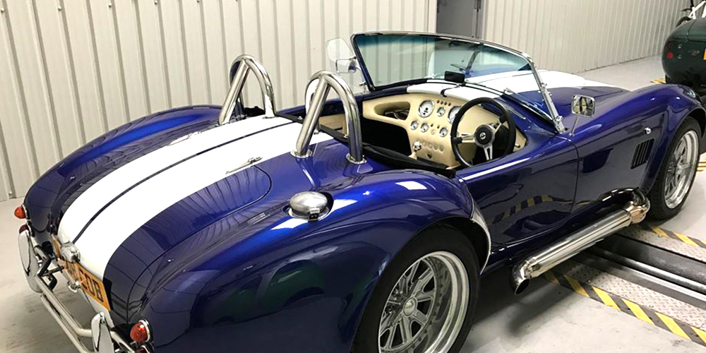 blue ac cobra housed at topcats racing workshop