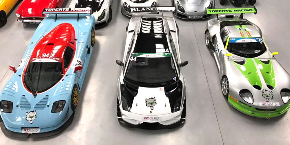 overhead view of topcats racing performance cars including marcos mantis, mosler mt900 and lamborghini gallardo